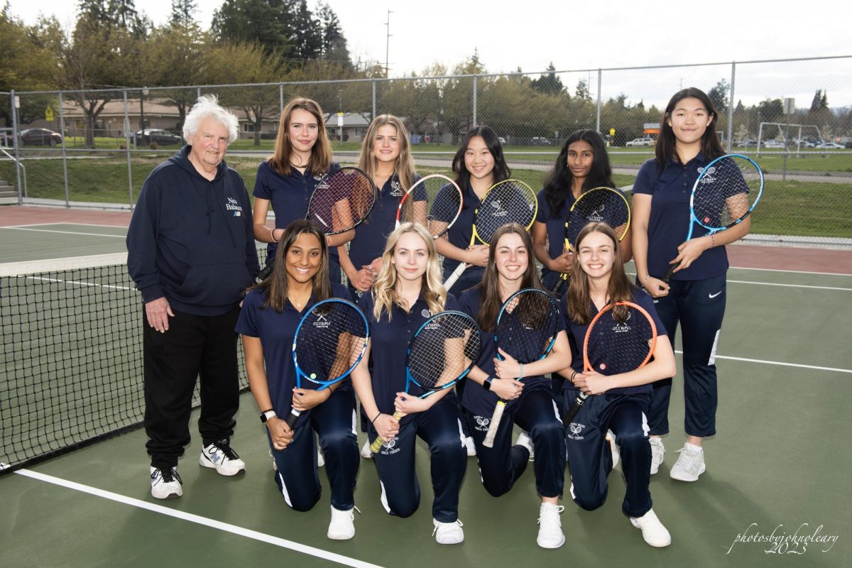 The 2022-2023 Varsity Girls Tennis team posing for a team picture. Photo courtesy of John OLeary. 