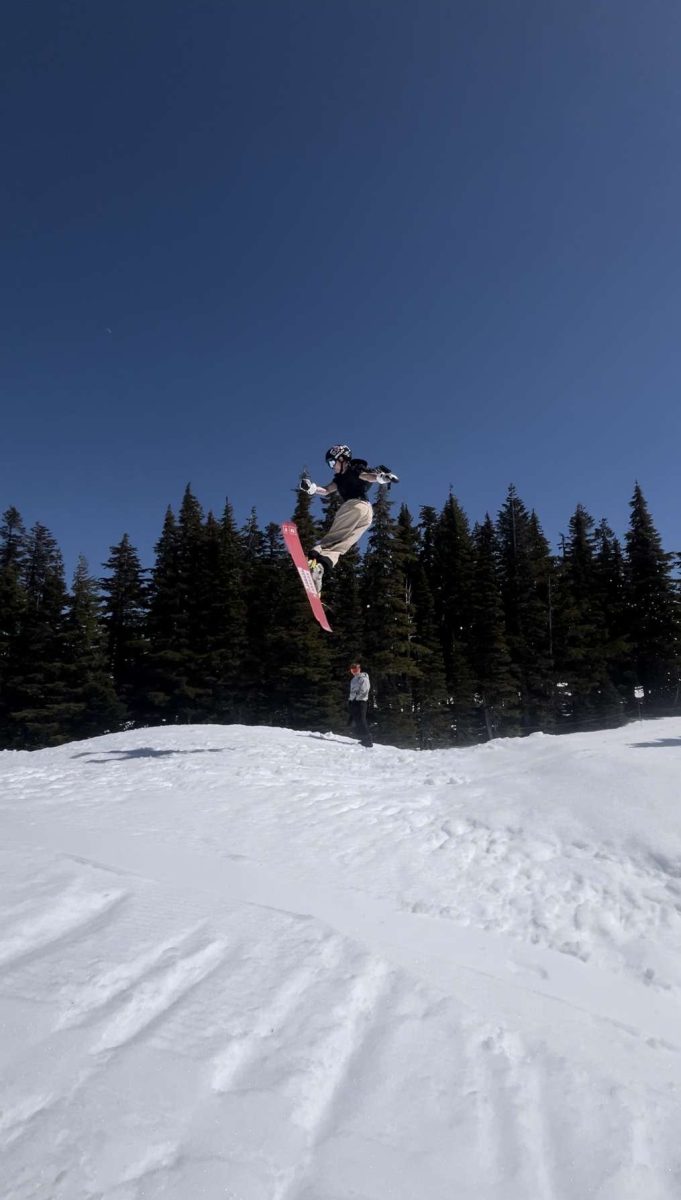 Maia Maki catches air on the slopes, carving through the snow with skill and style! Photo by: Maia Maki.