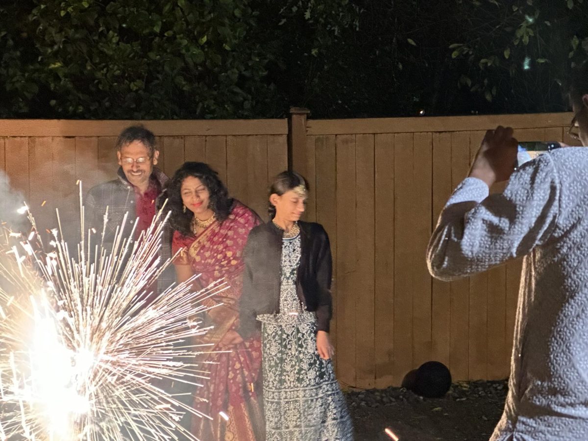 Murli Patro and his family lighting fireworks at a family celebration for Diwali. Photo by Jonah Song.