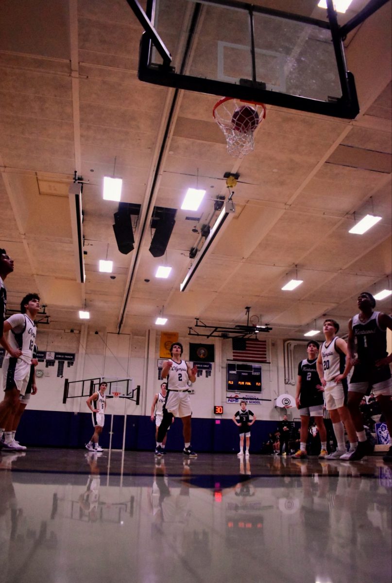 Senior Cameron Downing making a free throw as the trench cheers on the Bears.