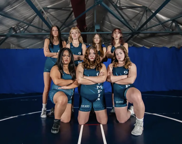  The OHS Girls Wrestling team striking a fierce pose, ready to defeat their opponents. Although the sport is cutthroat and competitive, the girls have formed close friendships with each other.