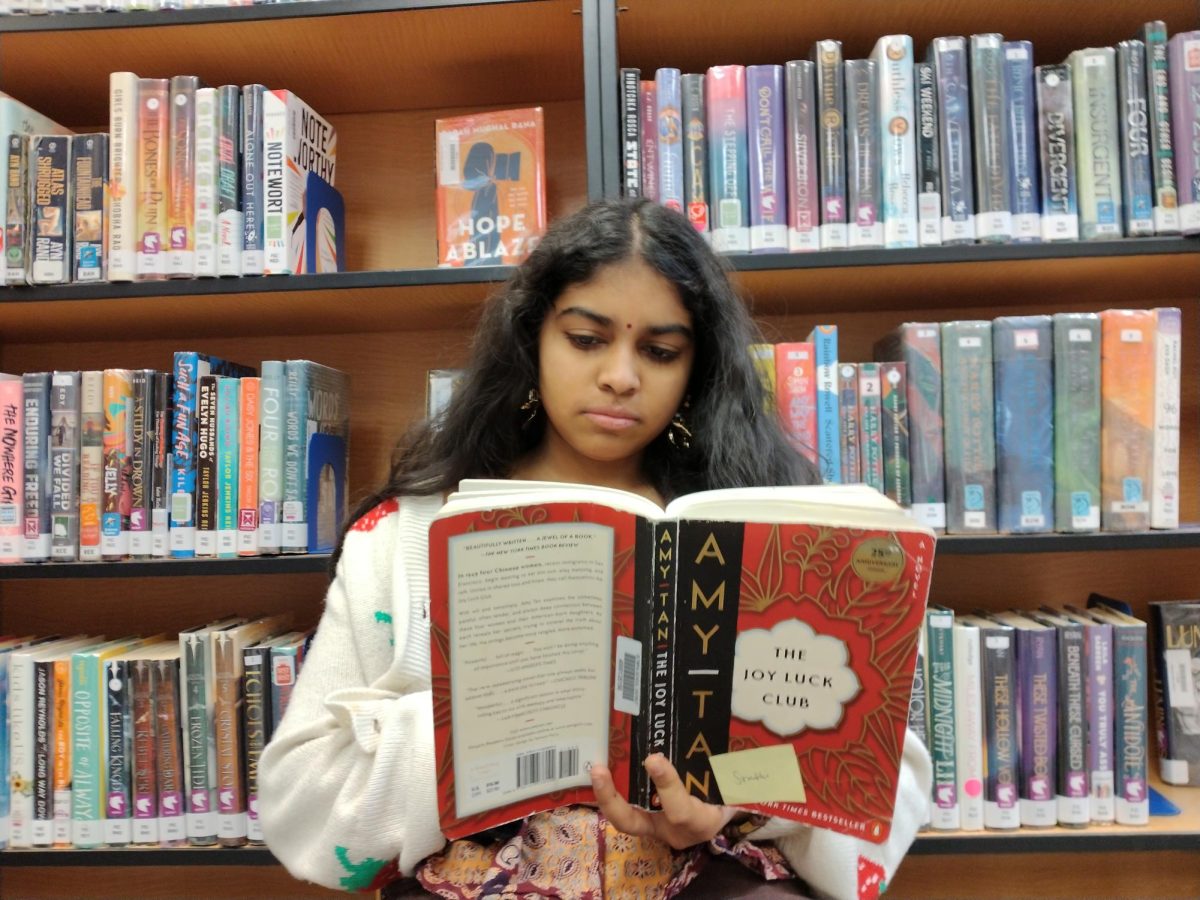 Freshman Sruthi Namboothiri reads The Joy Luck Club for Honors English 9. Like most English classes offered at OHS, the class is literature based.