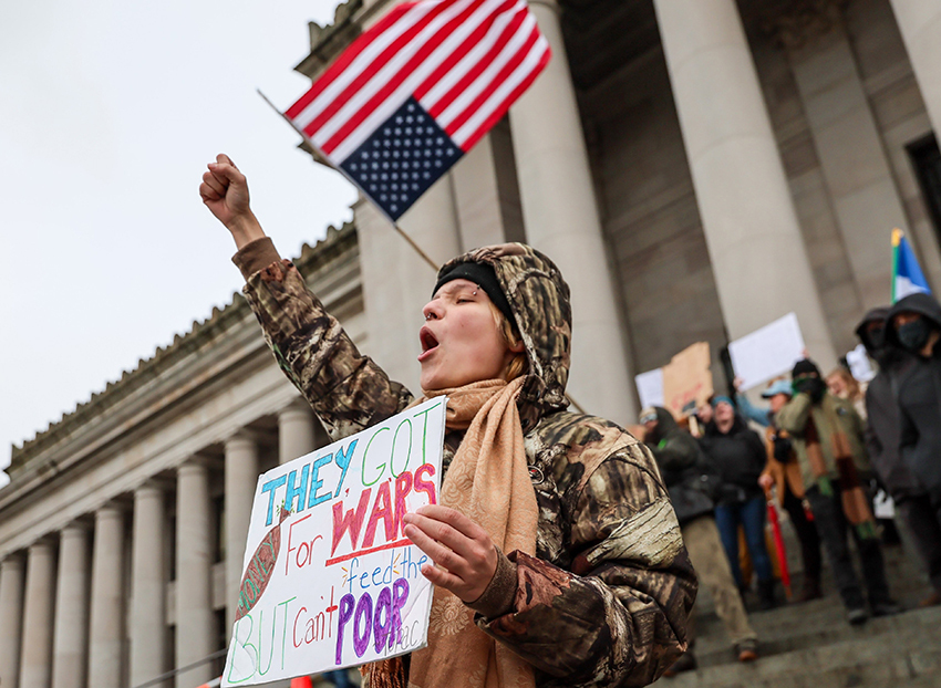 Jules Blakely emboldens the crowd by leading the chant, “Say it loud! Say it clear!” atop the Capitol steps. The crowd booms, “Immigrants are welcome here!” in reply. Olympia makes the statement: we stand with our immigrant neighbors and friends.